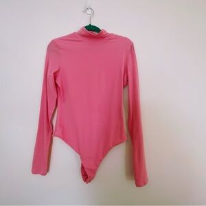 Hot pink body suit